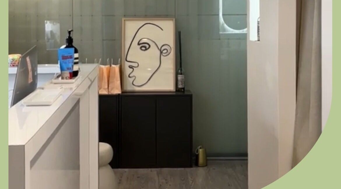 Inner Beauty Sydney's chic lobby in Chatswood, New South Wales, AU, featuring modern art and sleek decor.