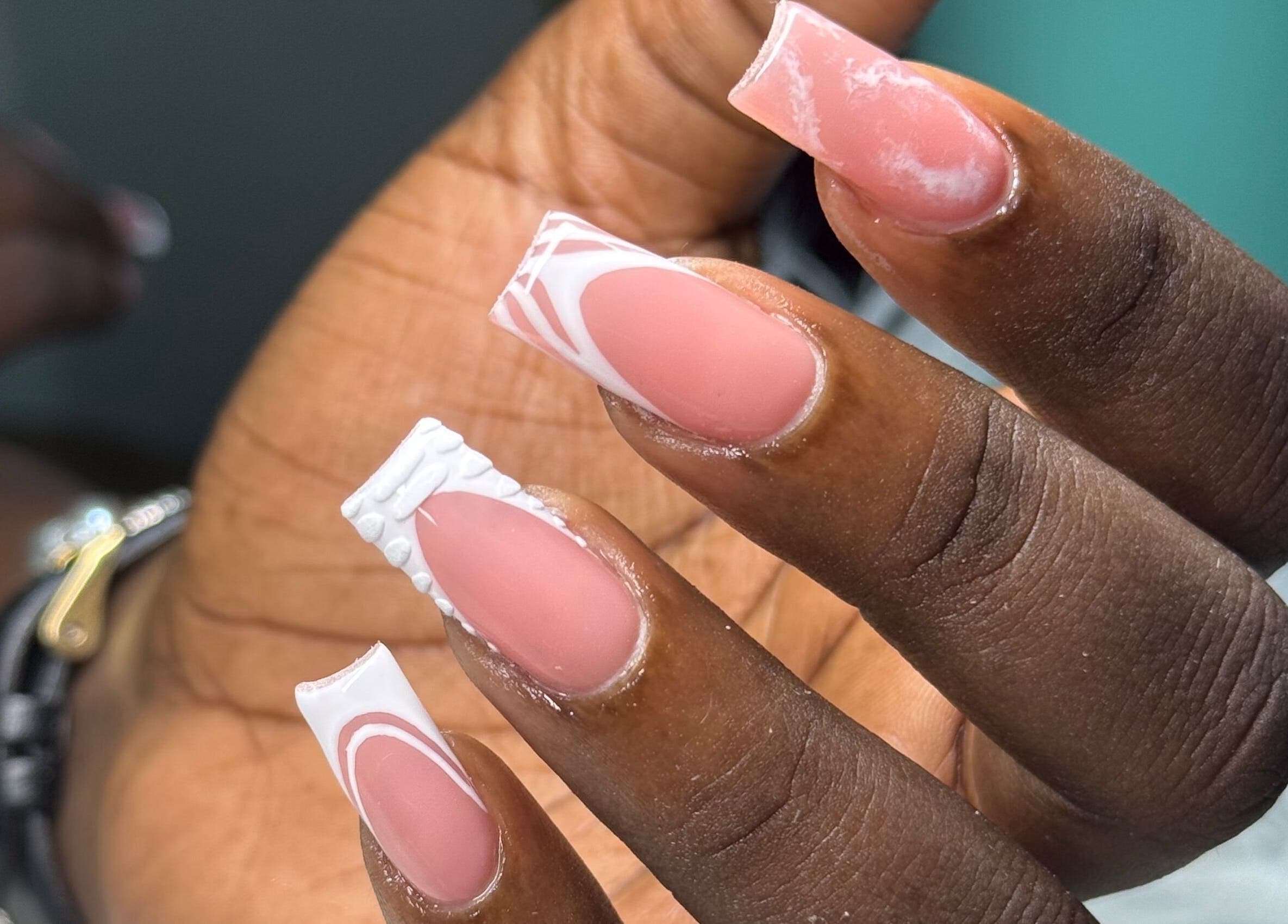 Elegant manicured nails at Nails by Dark.Indi, Kingston, St. Andrew Parish, JM, showcasing intricate French designs.