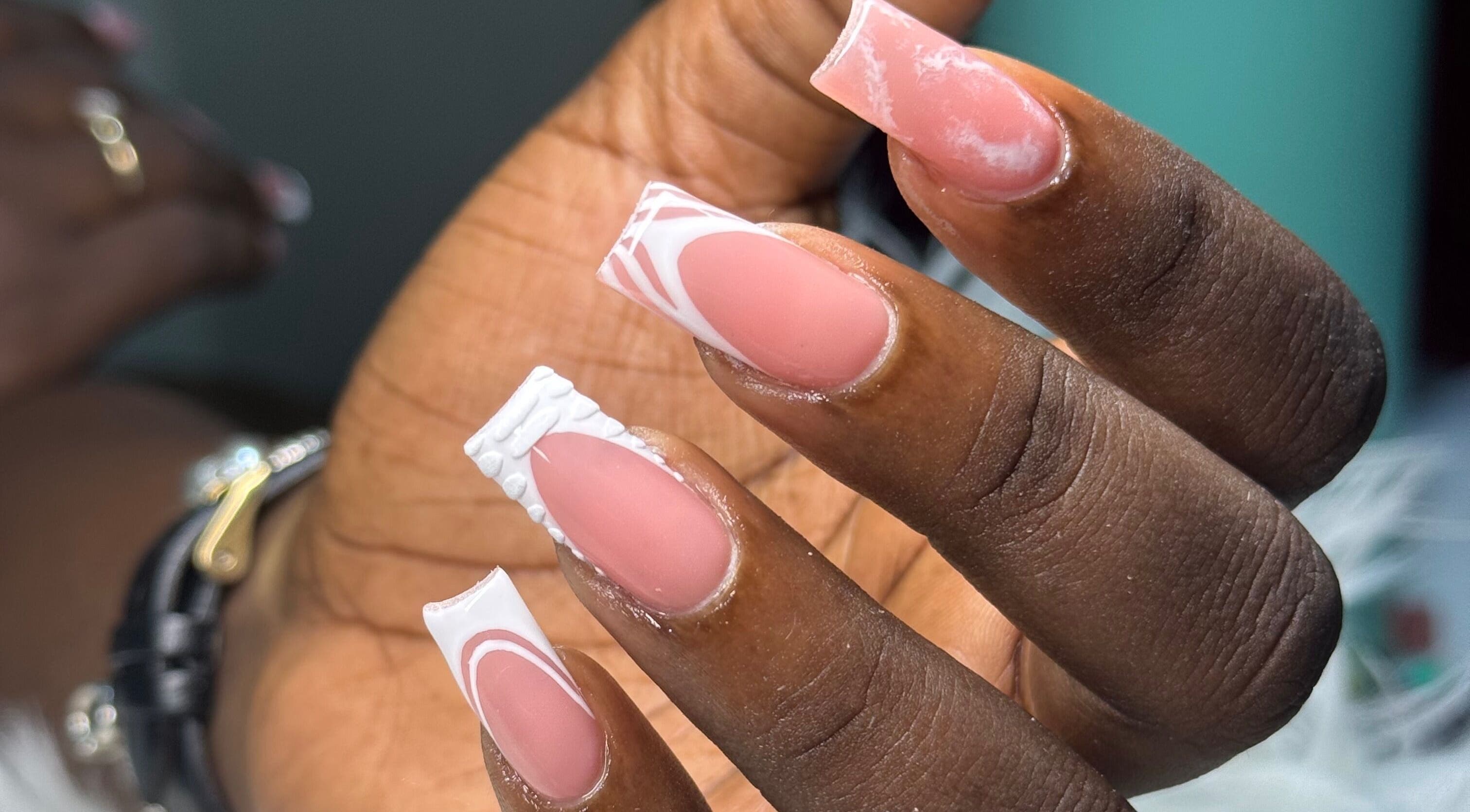 Elegant manicured nails at Nails by Dark.Indi, Kingston, St. Andrew Parish, JM, showcasing intricate French designs.