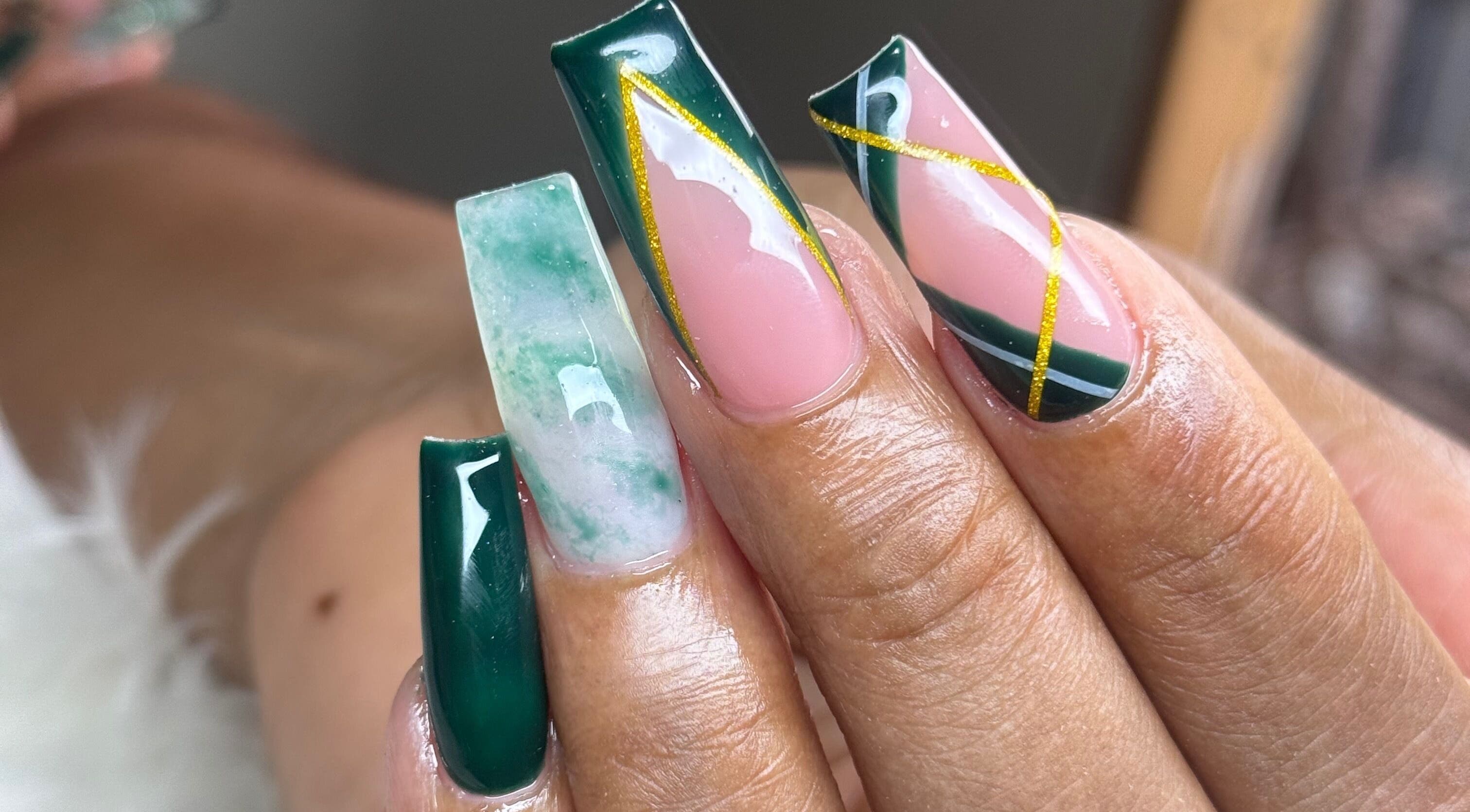 Elegant nail art at Nails by Dark.Indi, Kingston, St. Andrew Parish, JM, featuring green and gold accents.