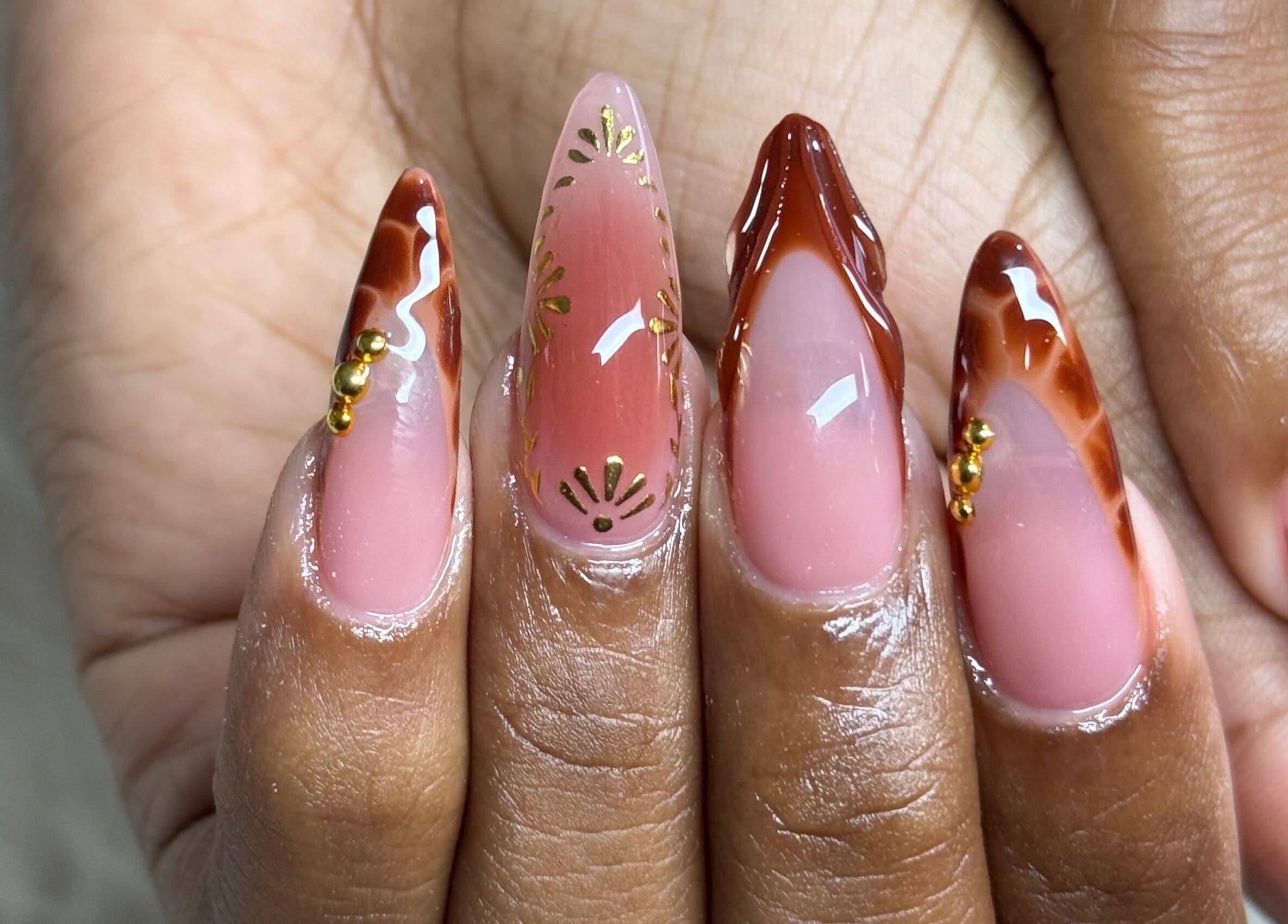 Stylish nail art at Nails by Dark.Indi, Kingston, St. Andrew Parish, JM. Elegant pink and brown designs.