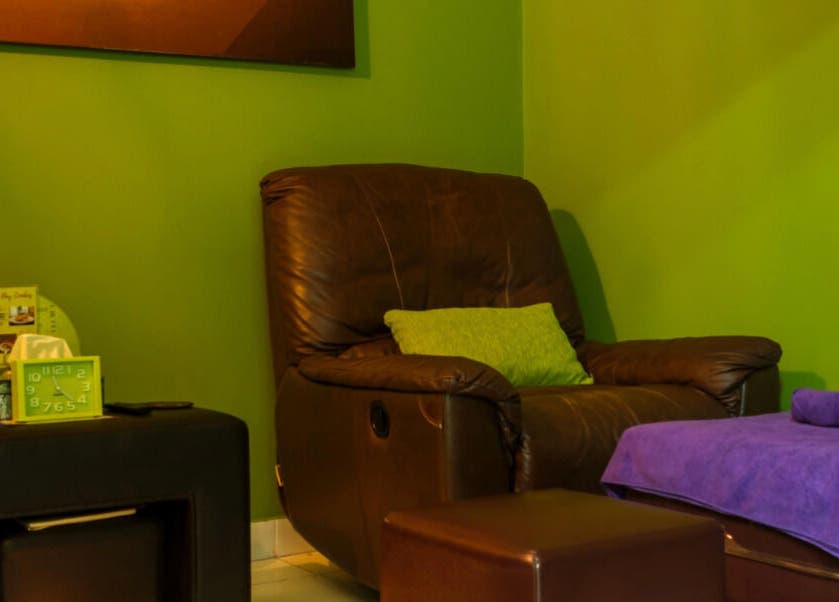 Comfortable brown chair with green accents at The Spa, Díli, Dili, TL.