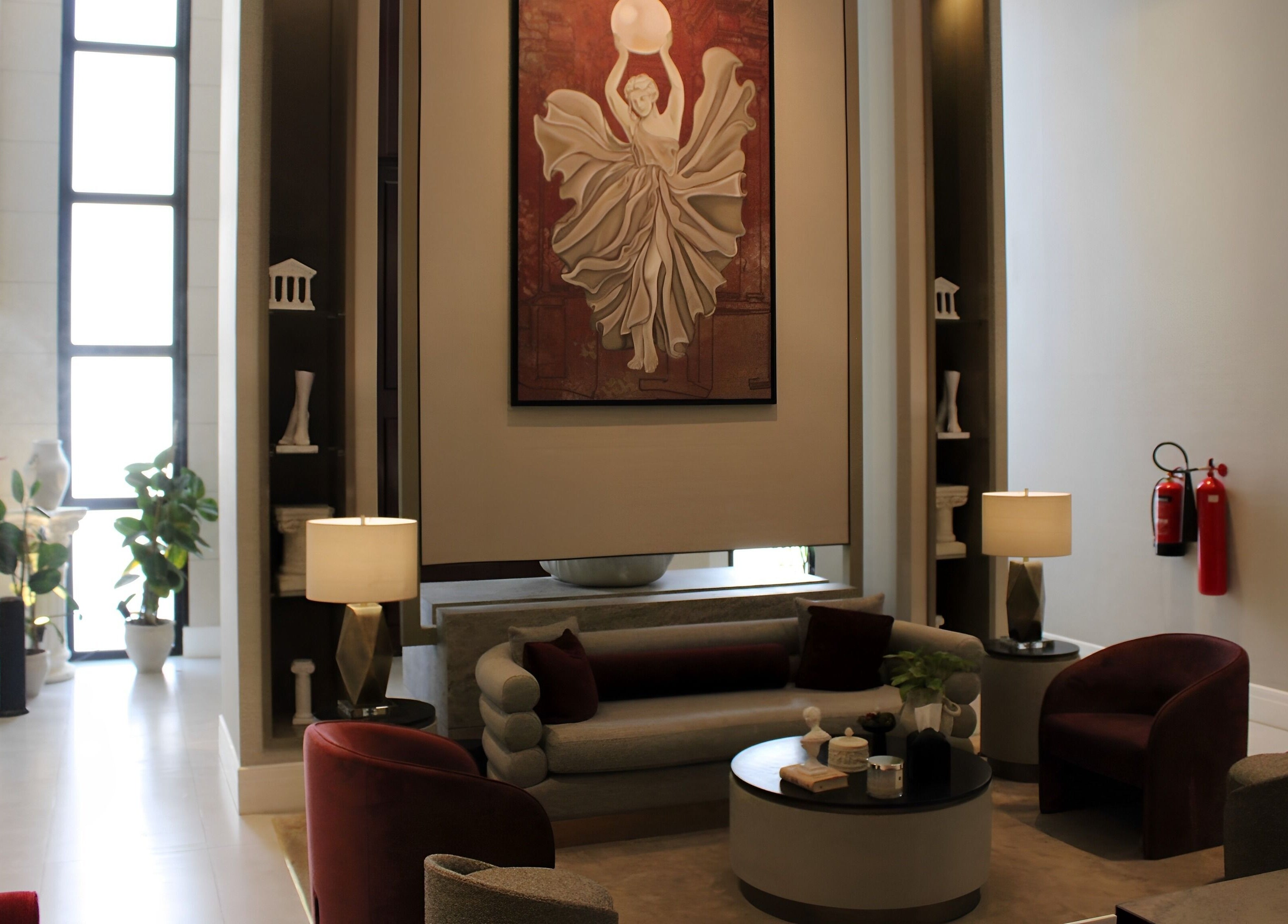 Chic lounge area at Myalo Spa in Riyadh, Riyadh Province, SA with modern art and plush seating.