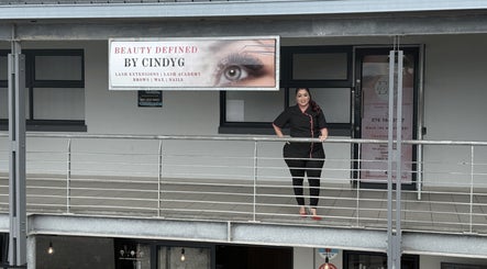 Exterior of Beauty Defined By Cindy G in Gqeberha, Eastern Cape, ZA with a welcoming staff member.