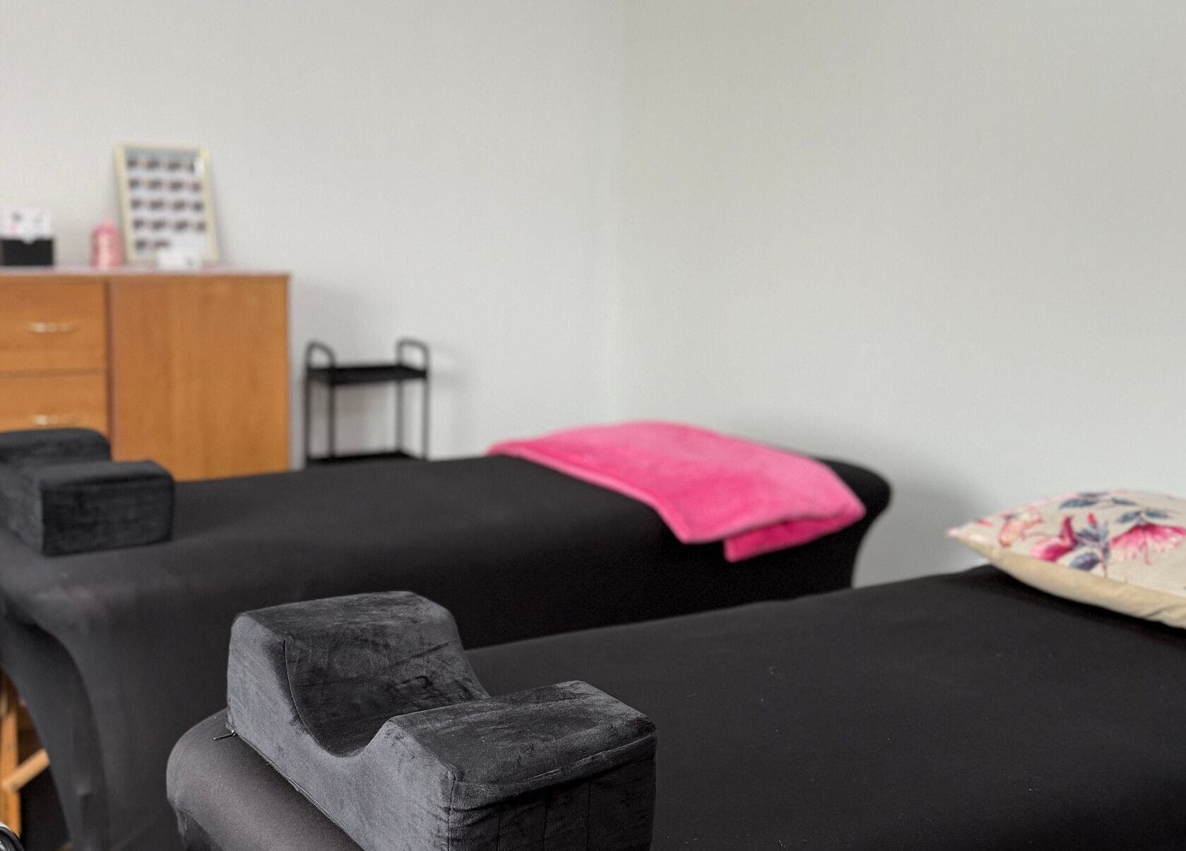 Relaxing spa treatment room at Beauty Defined By Cindy G in Gqeberha, Eastern Cape, ZA, featuring massage beds.