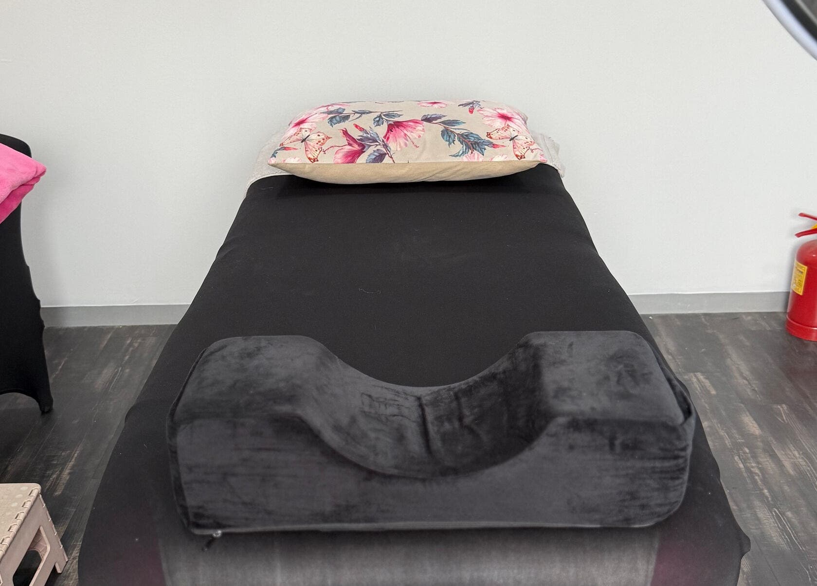 Tranquil treatment room at Beauty Defined By Cindy G in Gqeberha, Eastern Cape, ZA, with a black massage table.