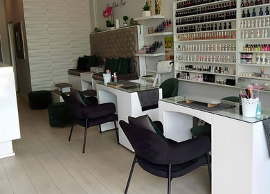 Modern interior of The Beauty Salon & Company in Roodepoort, Gauteng, ZA showcasing elegant nail care stations.