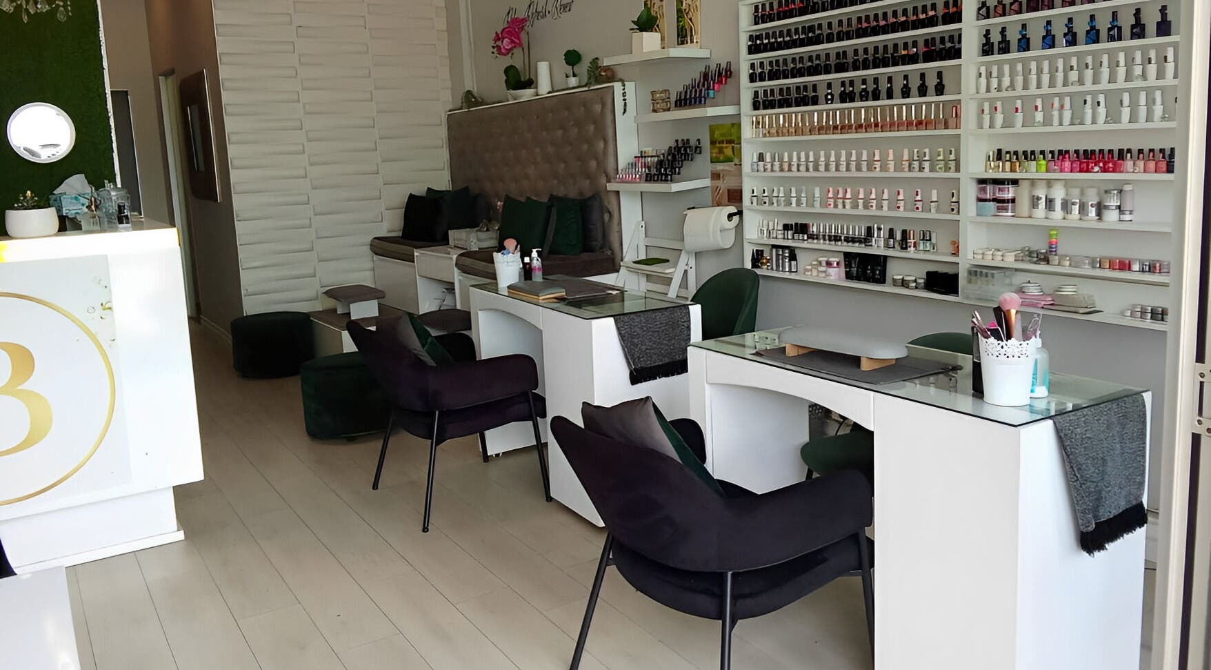 Modern interior of The Beauty Salon & Company in Roodepoort, Gauteng, ZA showcasing elegant nail care stations.