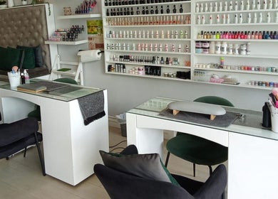 Elegant nail salon interior at The Beauty Salon & Company, Roodepoort, Gauteng, ZA with nail polish display.