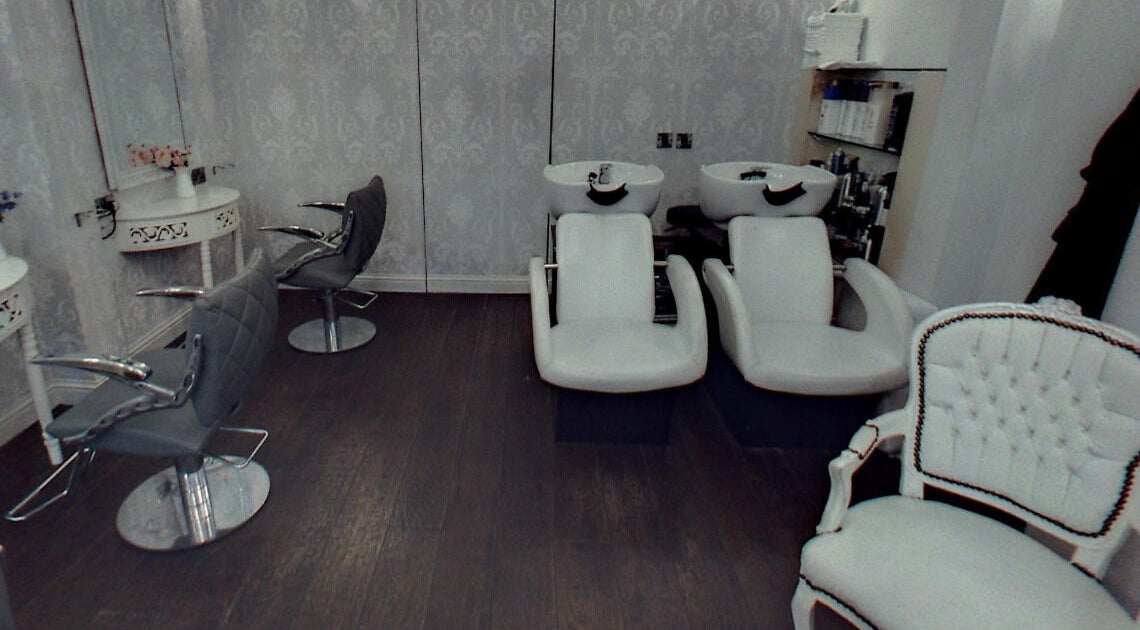 Elegant salon setup at Hair by Boom, featuring modern chairs and wash stations in Edinburgh, Scotland, GB.