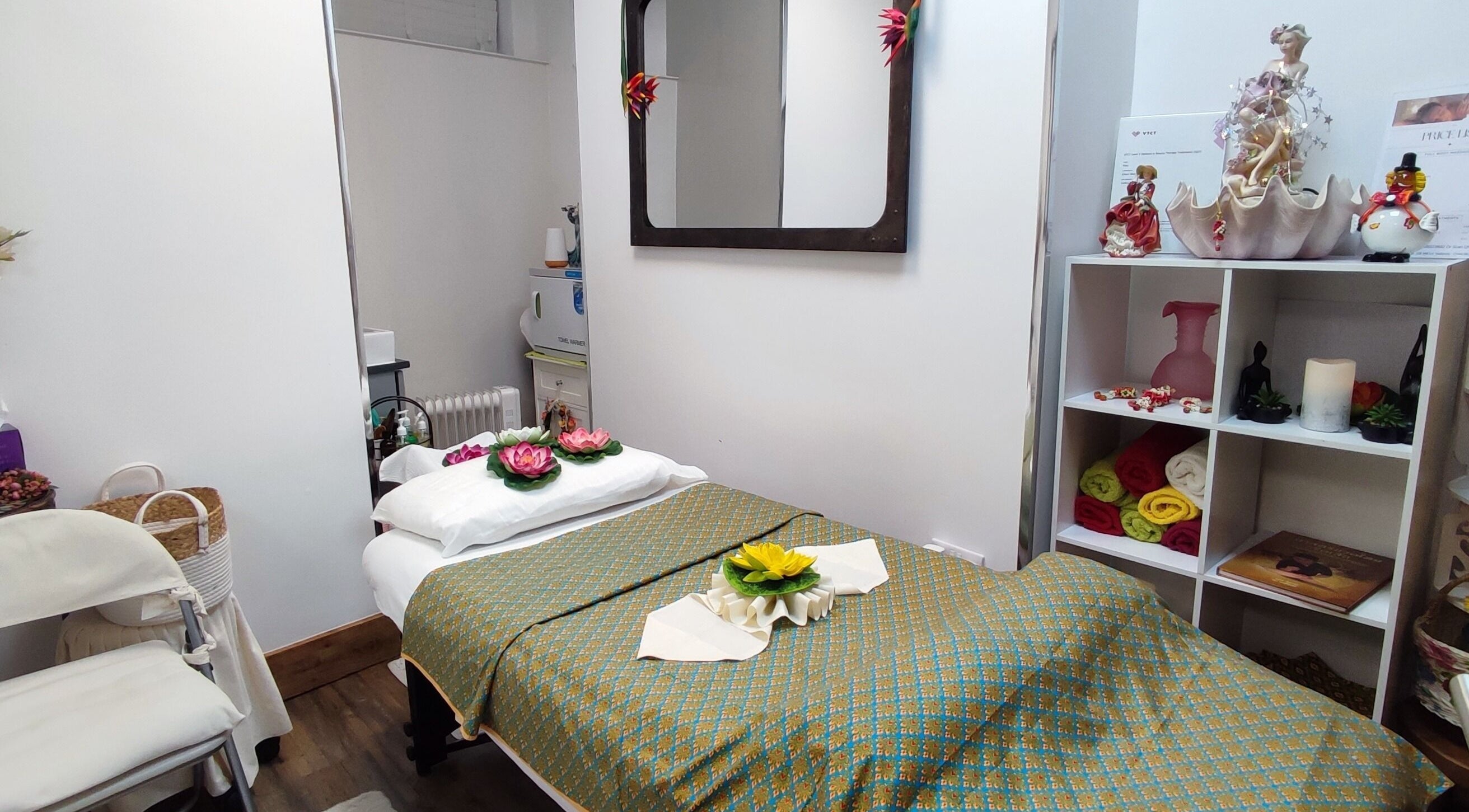 Absolut Thai Massage therapy room with decorated bed in Wallasey, England, GB.