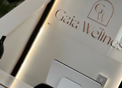 Reception area at Gaia Wellness, Berkswell, England, featuring a modern desk and serene decor.