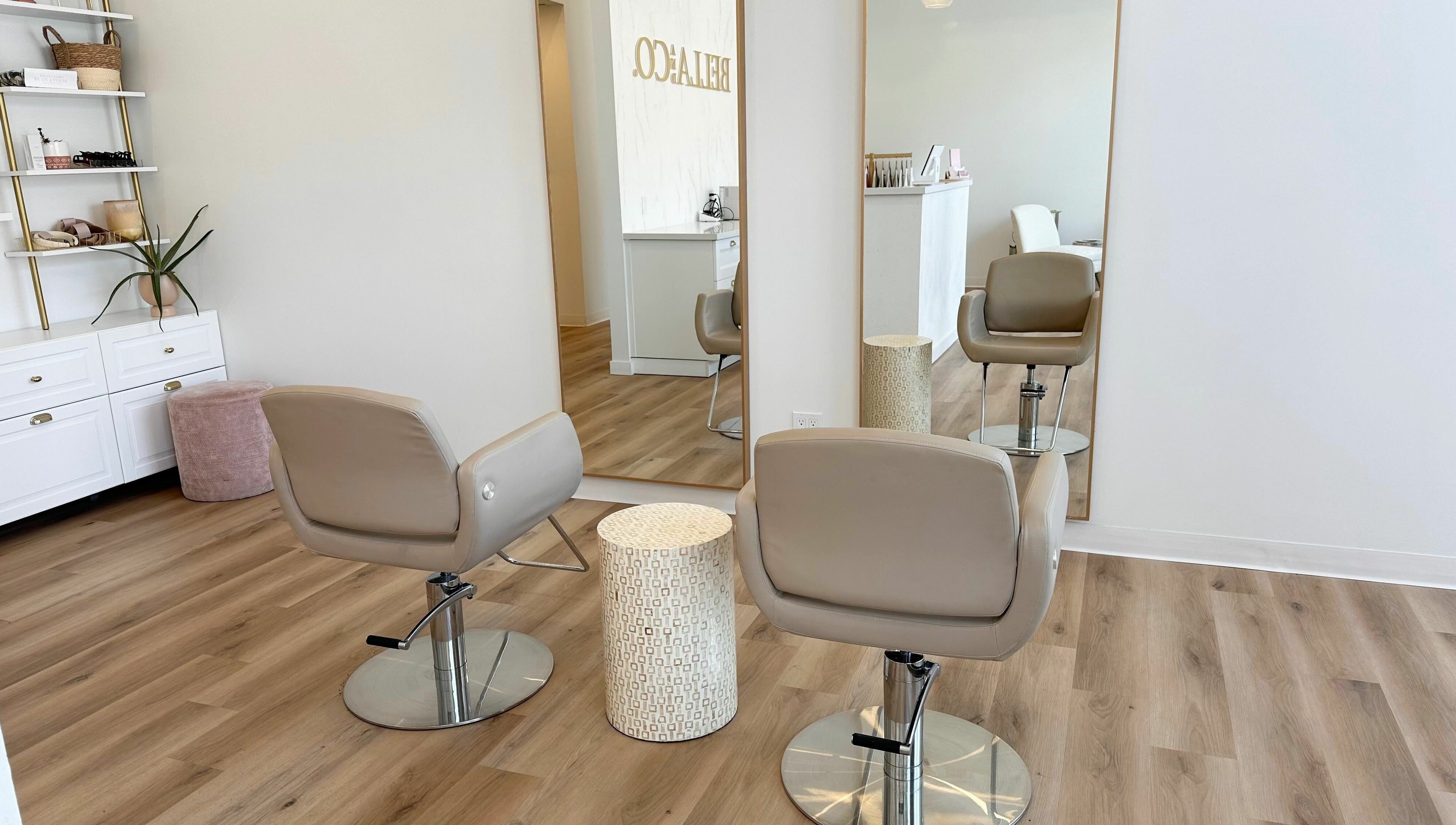 Modern interior of JM Extensions & Academy in Cambridge, Ontario, CA, featuring stylish salon chairs and mirrors.