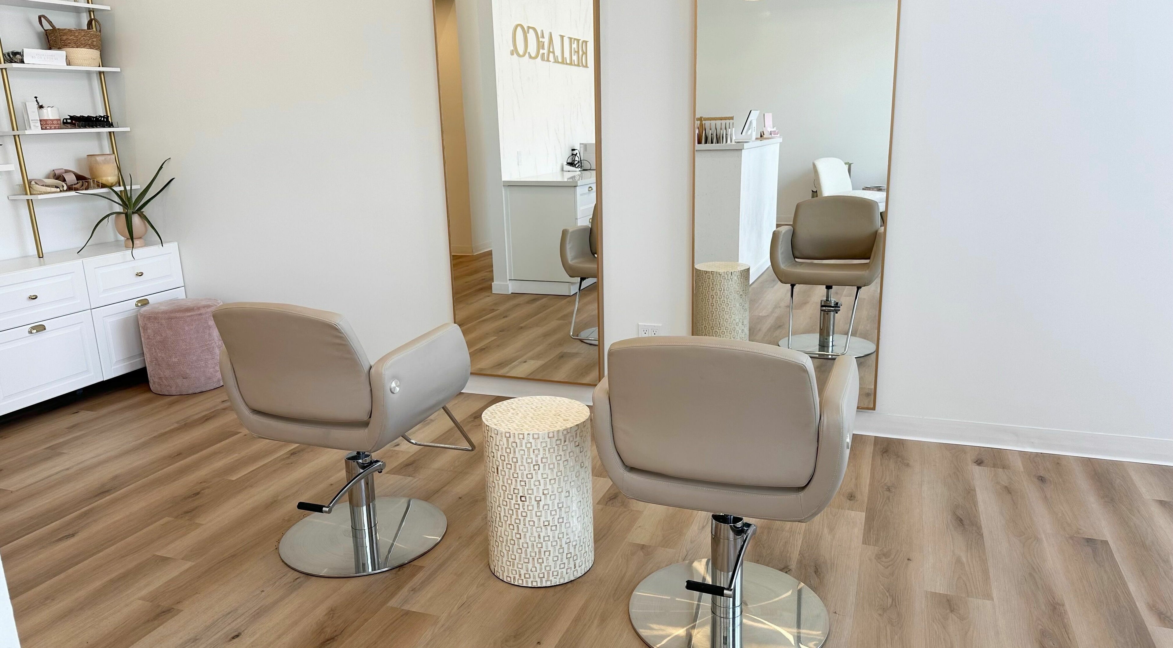 Modern interior of JM Extensions & Academy in Cambridge, Ontario, CA, featuring stylish salon chairs and mirrors.