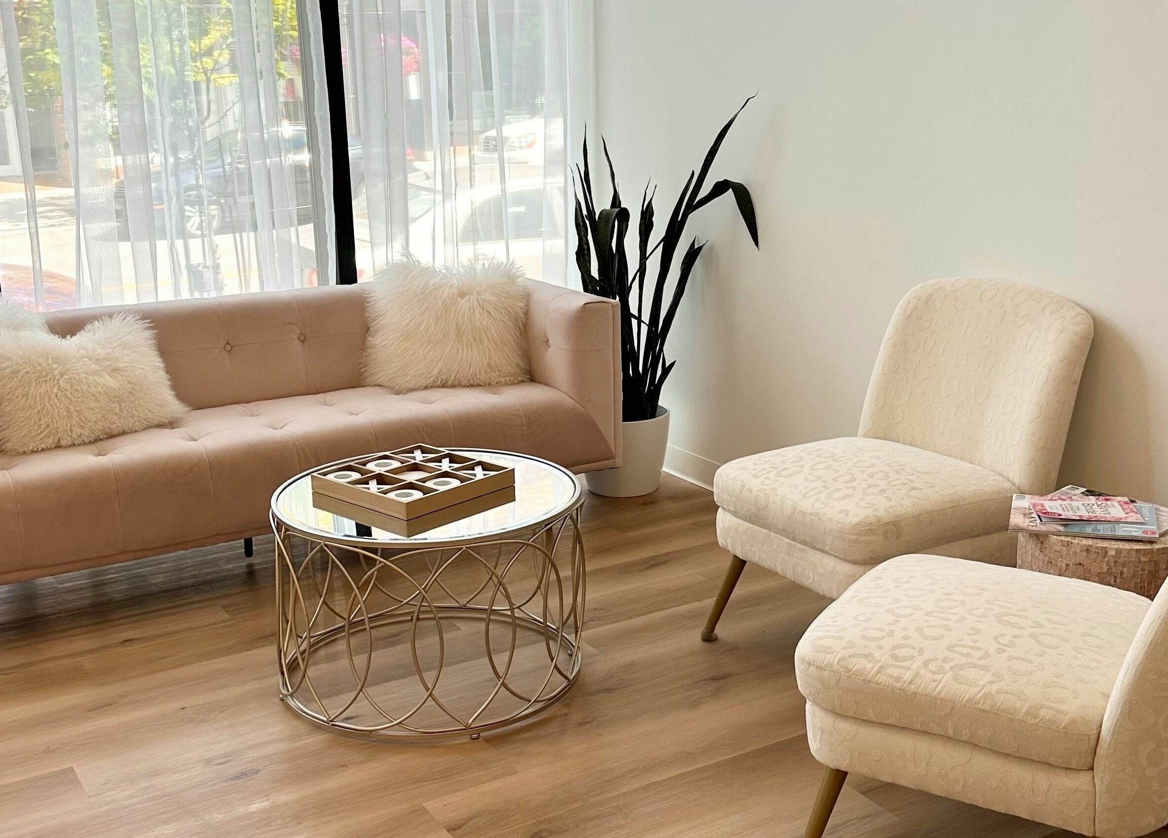 Elegant seating area at JM Extensions & Academy, Cambridge, Ontario, CA with plush chairs and a stylish table.