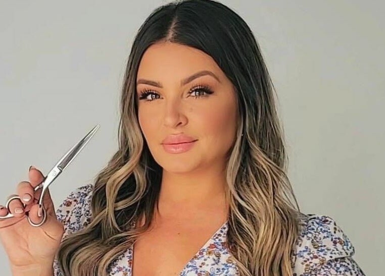 Professional stylist with scissors at JM Extensions & Academy, Cambridge, Ontario, CA.