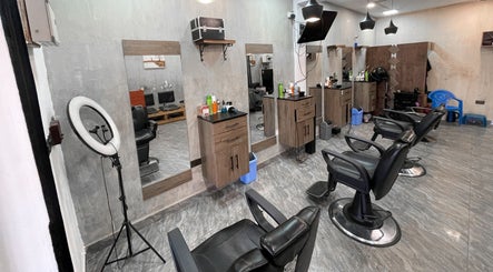 Modern salon interior at haircutzpalace plus, Kumasi, Ashanti Region, GH showcasing sleek styling stations.