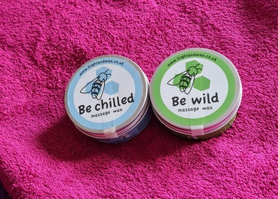 Massage waxes at RENUMI Mind-Body Therapies & Coaching, Musselburgh, Scotland, GB, on a vibrant pink towel.