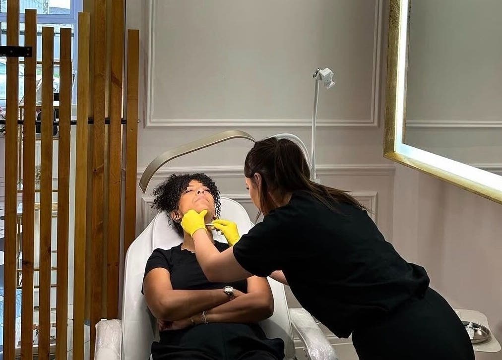 Beauty therapy session at Blossom Aesthetics & Skin, Failsworth, England, GB, room with a mirror.