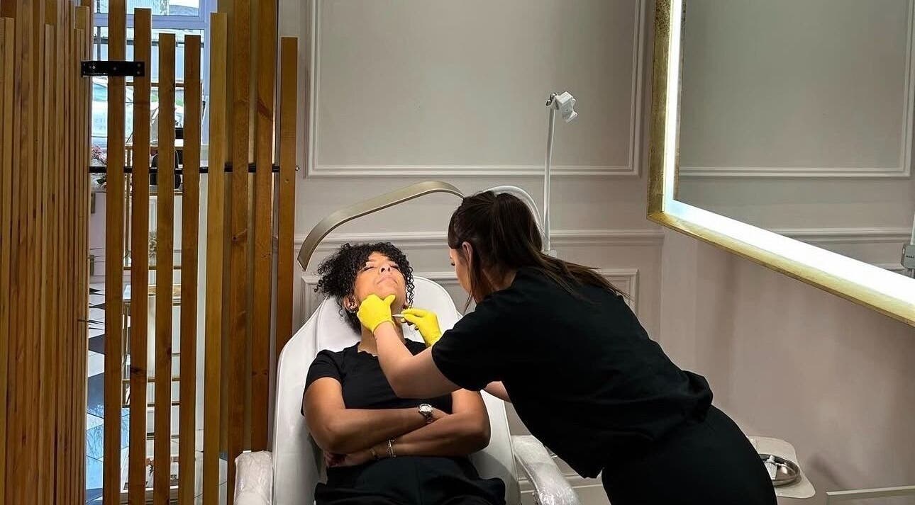 Beauty therapy session at Blossom Aesthetics & Skin, Failsworth, England, GB, room with a mirror.