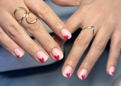 Heart-tipped manicure at Lulabells Bristol, Bristol, England, GB showcasing elegant nail art.