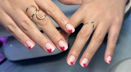 Heart-tipped manicure at Lulabells Bristol, Bristol, England, GB showcasing elegant nail art.