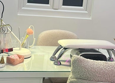 Nail station setup at Lulabells Bristol, featuring manicure tools and a cozy chair in Bristol, England, GB.