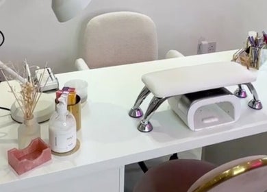 Nail station at Lulabells Bristol in Bristol, England, GB with stylish tools on a white desk.