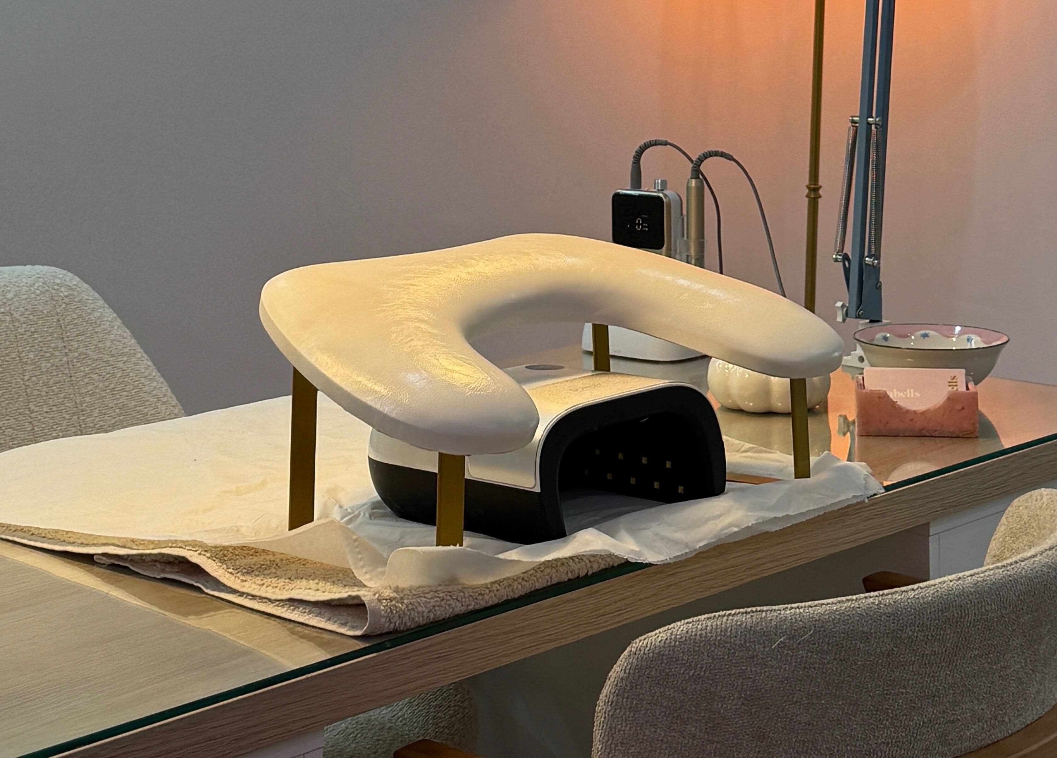 Manicure station at Lulabells Bristol featuring modern nail dryer. Located in Bristol, England, GB.
