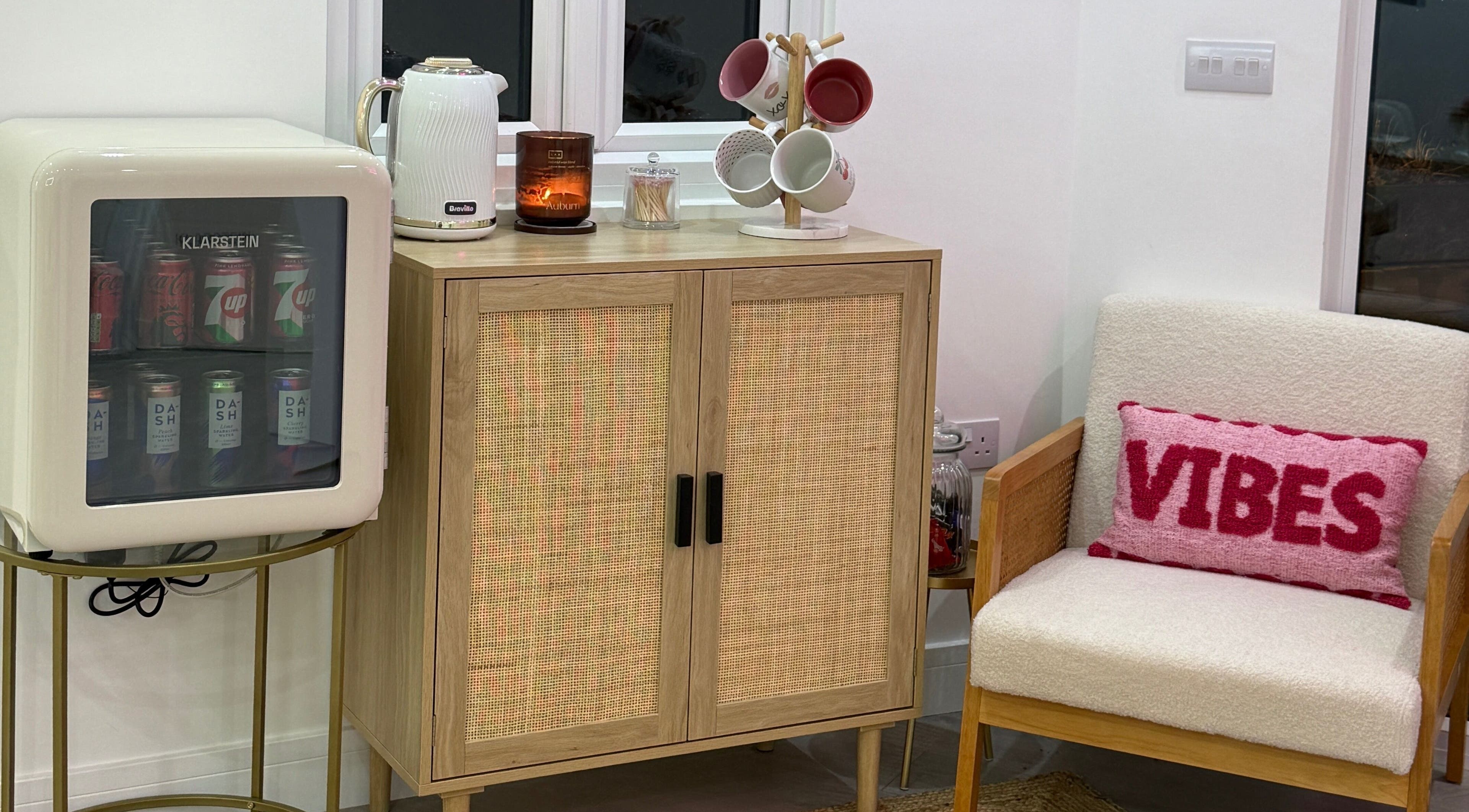 Cozy nook at Lulabells Bristol with mini fridge, comfy chair, and modern decor, Bristol, England, GB.