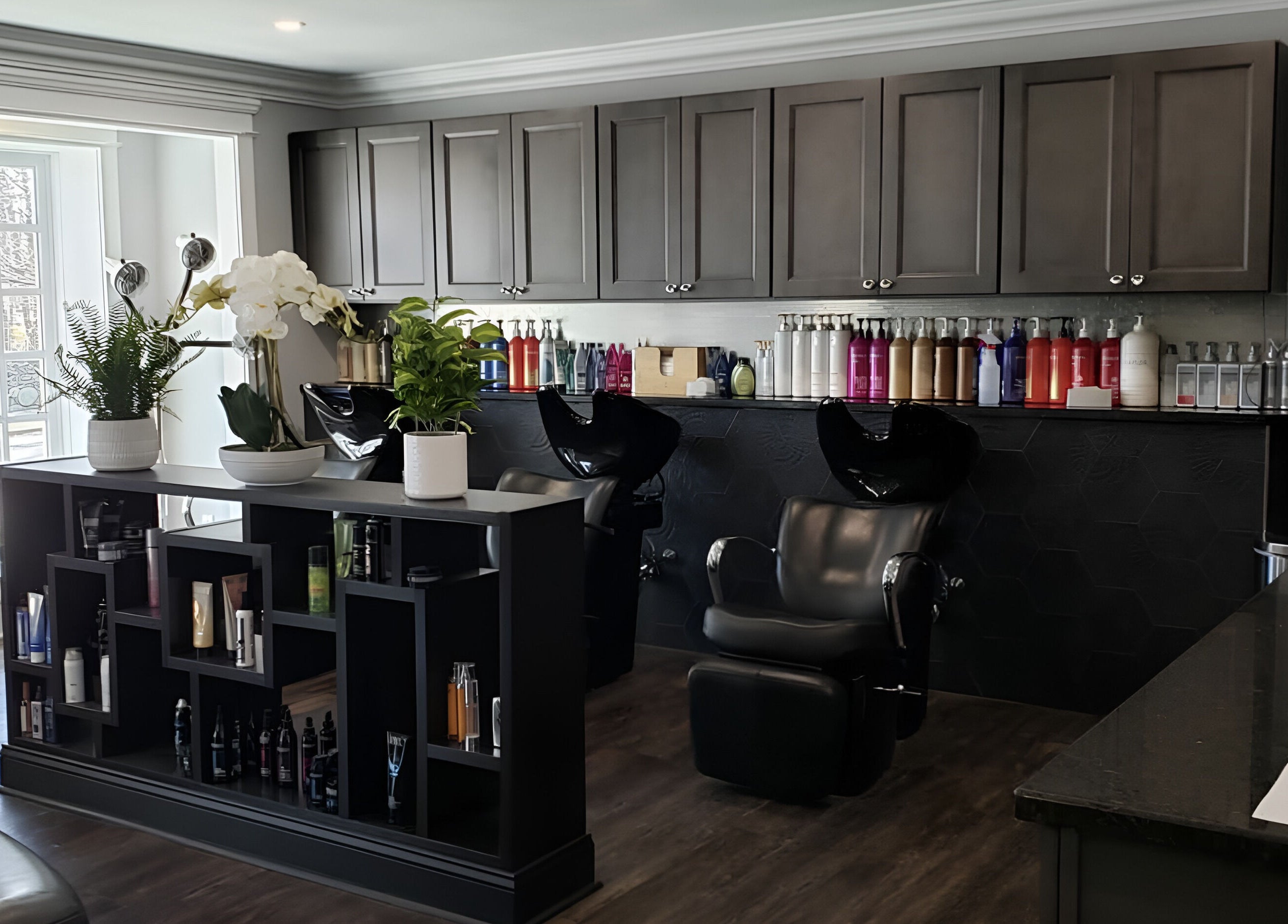 Sophisticated interior of Paris Salon in Ridgefield, Connecticut, US, featuring styling chairs and product display.