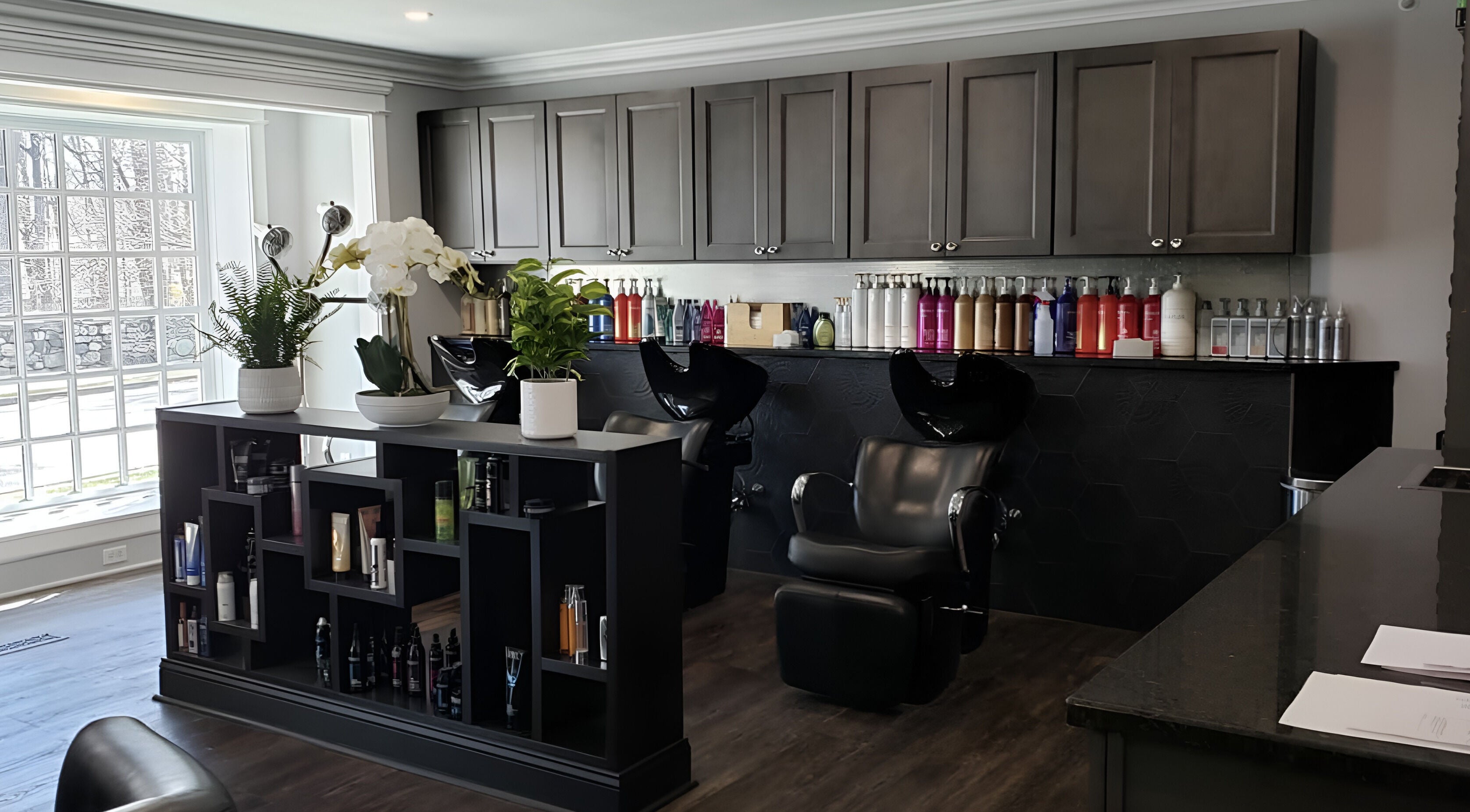 Sophisticated interior of Paris Salon in Ridgefield, Connecticut, US, featuring styling chairs and product display.