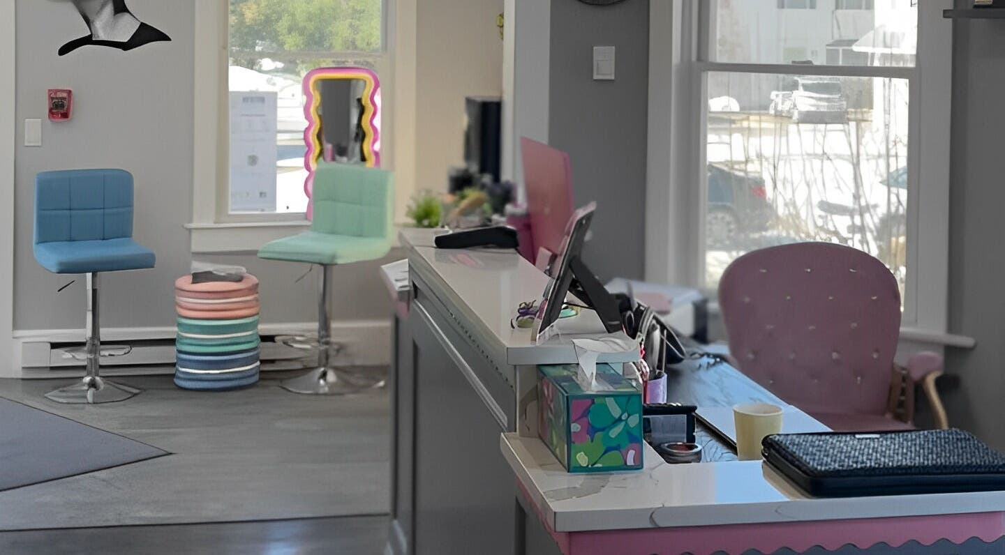 Trendy reception area at Paris Salon, Ridgefield, Connecticut, US with pastel decor and modern seating.
