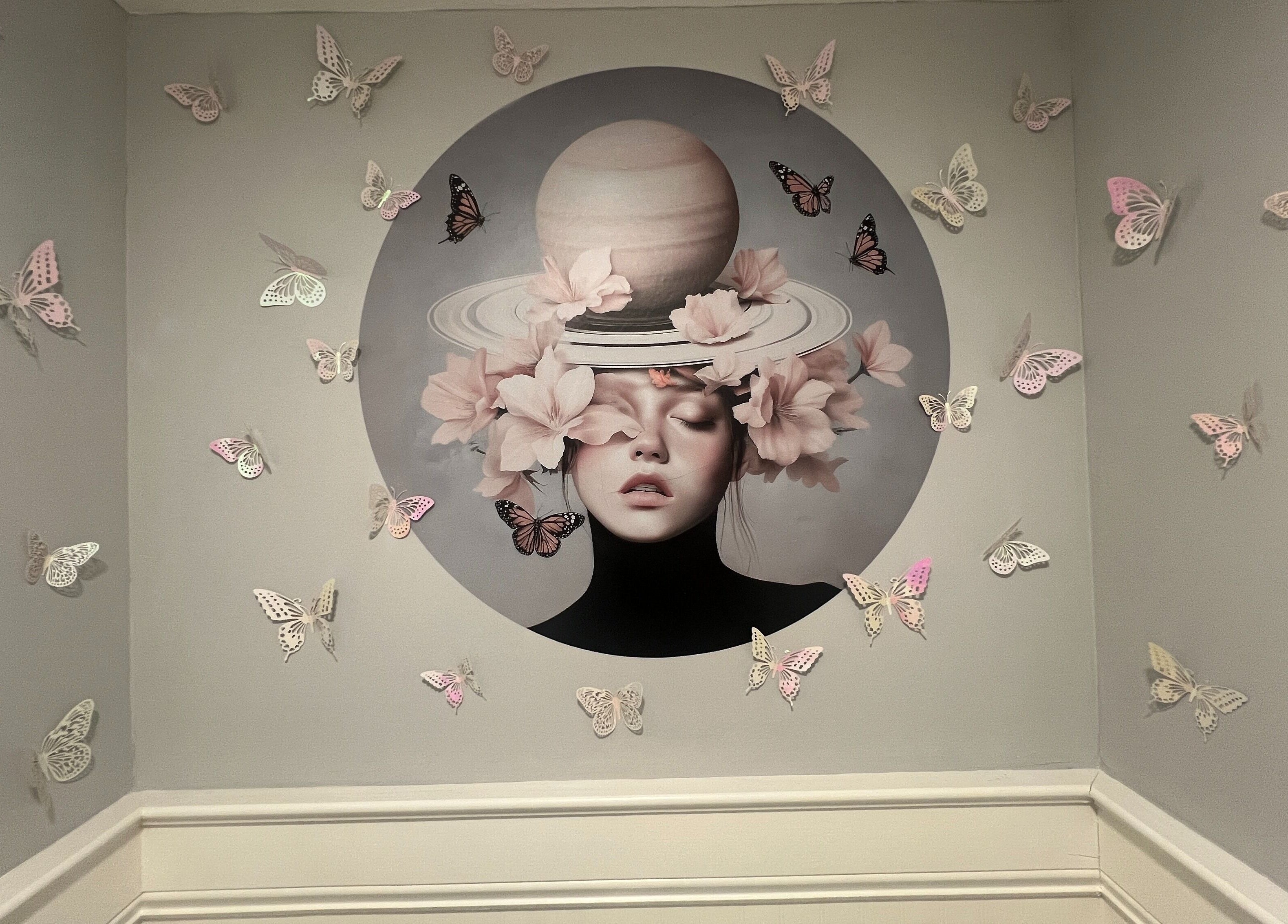 Artistic butterfly wall mural at Paris Salon, Ridgefield, Connecticut, US, adding whimsy and elegance to the space.