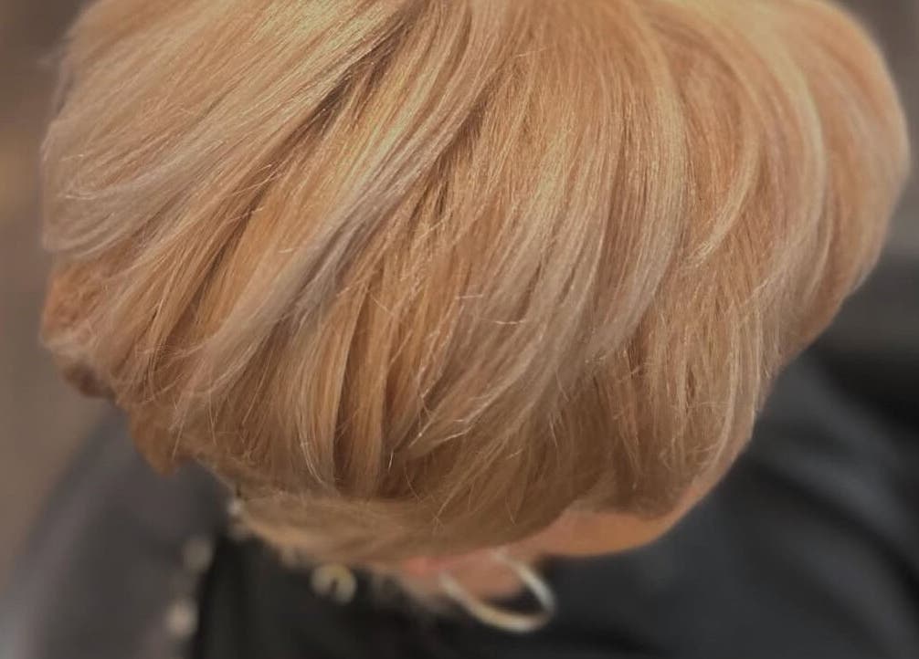 Blonde hairstyle showcased at Paris Salon, Ridgefield, Connecticut, US. Elegant and sleek design.