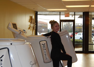 A woman enjoying a wellness treatment at RED HOT ZONE, Oakbrook Terrace, Illinois, US.