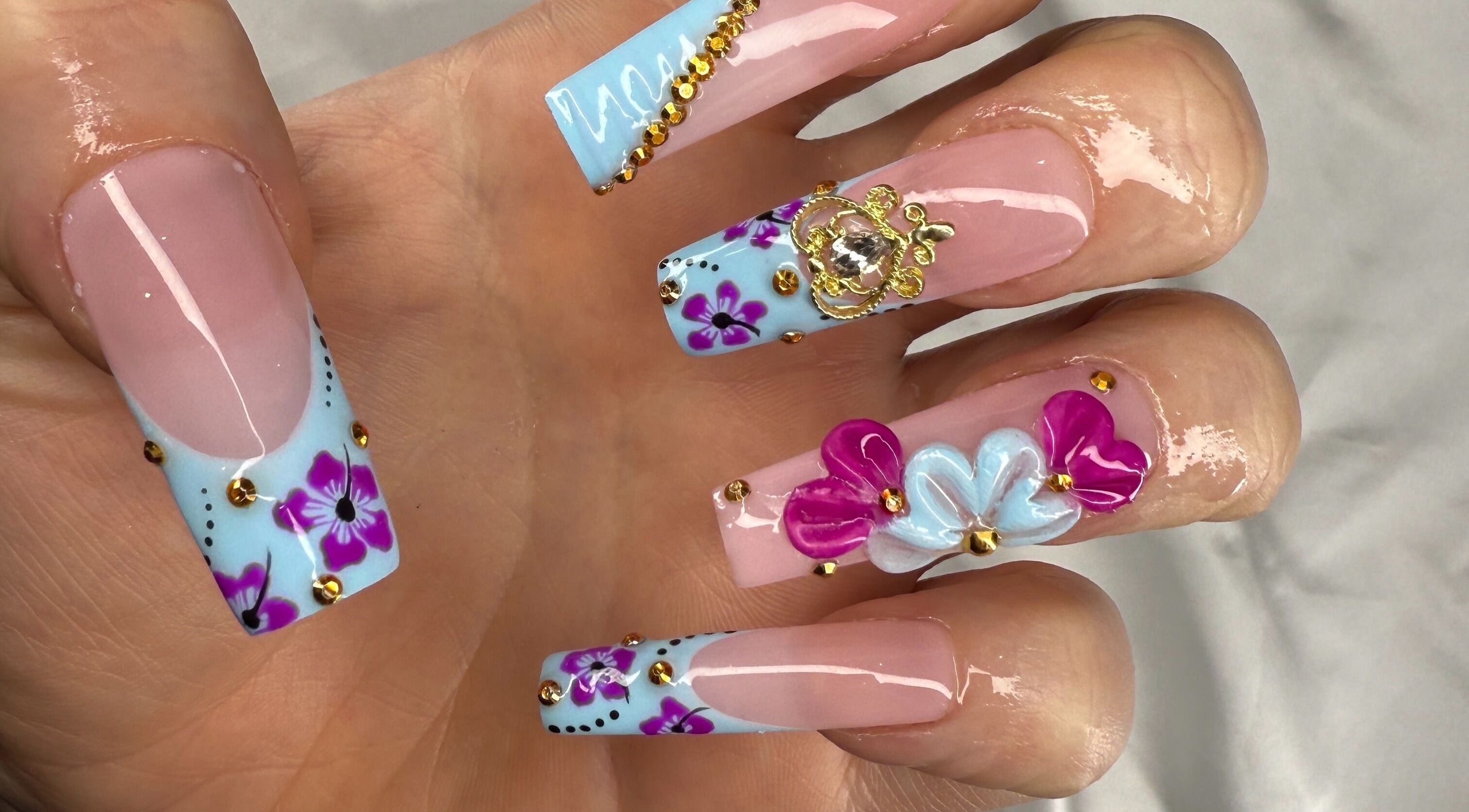 Intricate floral nail art with embellishments at Breezynailss, Melbourne, Victoria, AU on polished fingers.