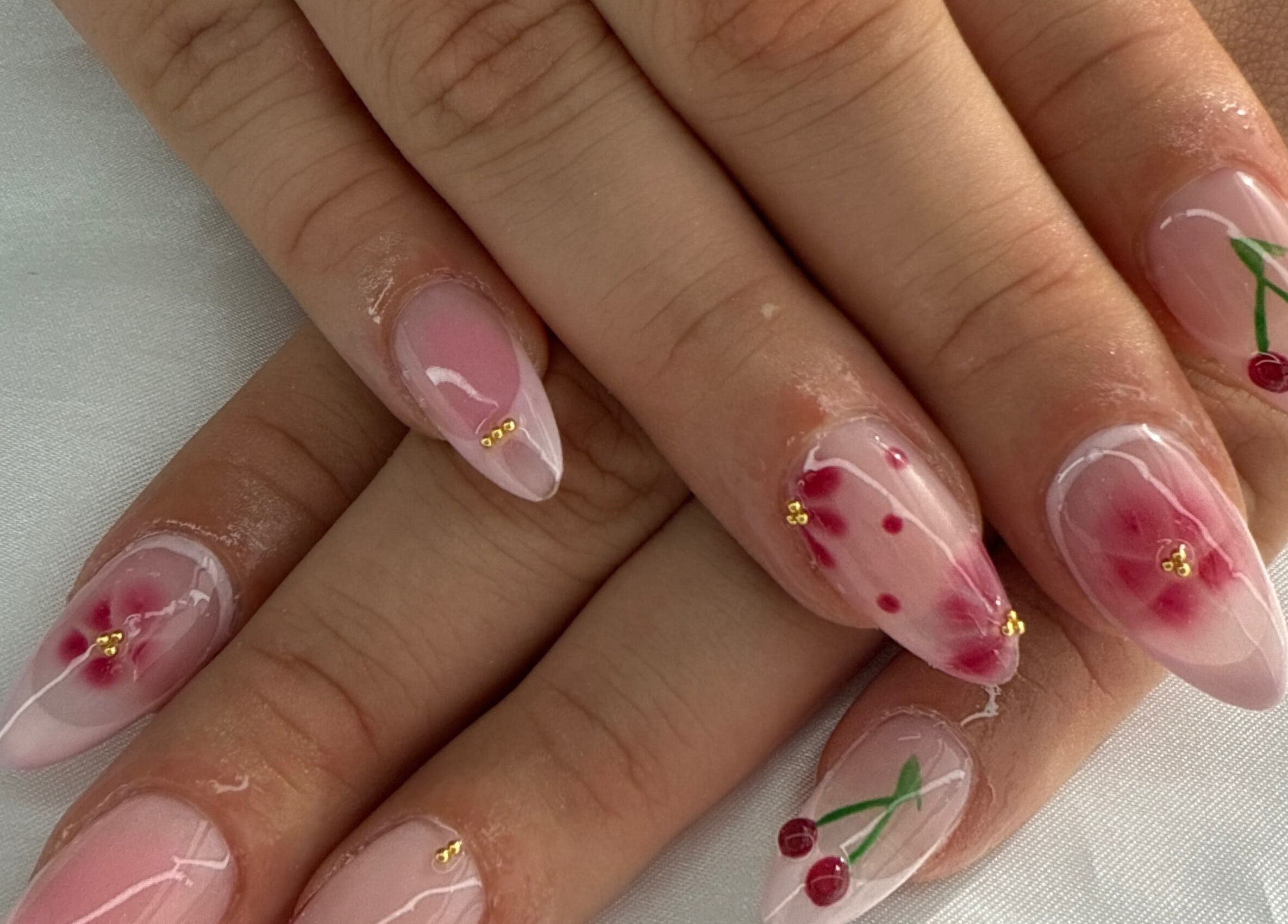 Elegant cherry and floral nail art at Breezynailss, Melbourne, Victoria, AU, showcasing intricate design.
