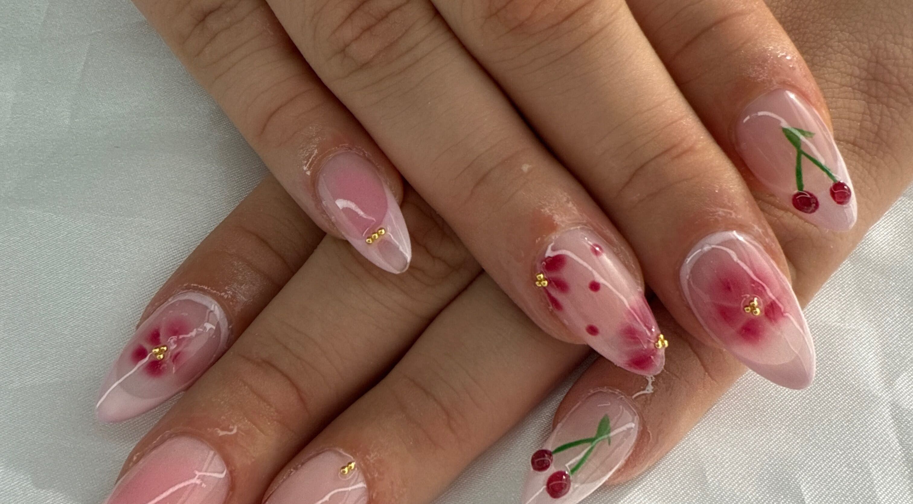 Elegant cherry and floral nail art at Breezynailss, Melbourne, Victoria, AU, showcasing intricate design.