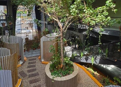 Lush green atrium at Aurora Spa I أورورا سبا in Riyadh, Riyadh Province, SA offering a serene wellness retreat.