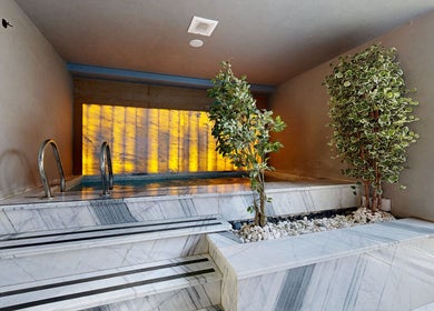 Luxurious indoor pool at Aurora Spa I أورورا سبا in Riyadh, Riyadh Province, SA with elegant marble steps.