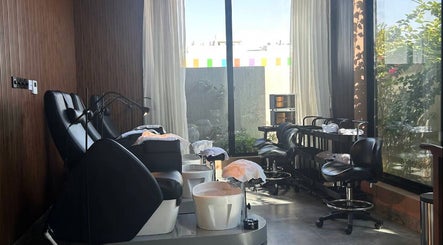 Relaxing pedicure area at Aurora Spa I أورورا سبا, Riyadh, Riyadh Province, SA with lush garden view.