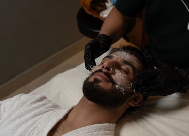 Man enjoying a facial treatment at Aurora Spa I أورورا سبا in Riyadh, Riyadh Province, SA.
