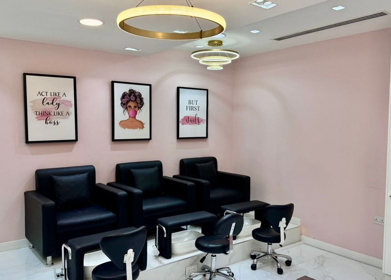 Stylish pedicure area at Beauty By Bella Salon, Dubai, Dubai, AE with modern chairs and chic decor.