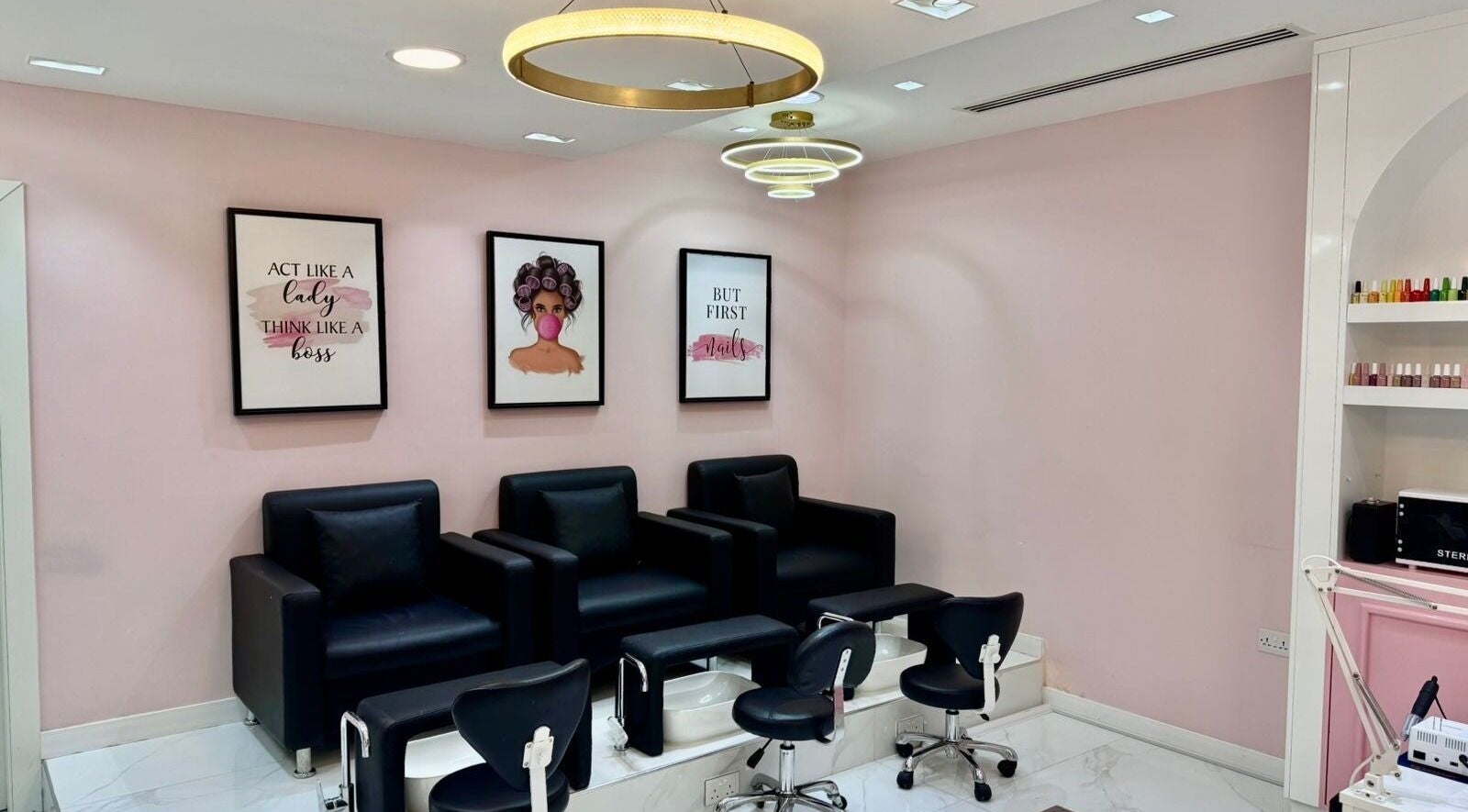 Stylish pedicure area at Beauty By Bella Salon, Dubai, Dubai, AE with modern chairs and chic decor.