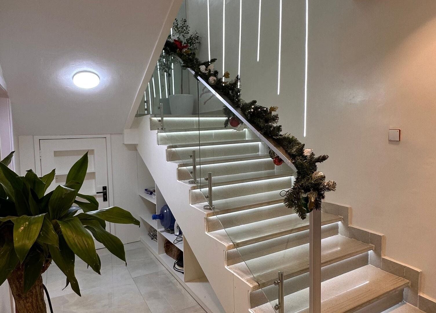 Elegant stairway at Indigoluxe Spa, Lagos showcasing modern design and ambient lighting.