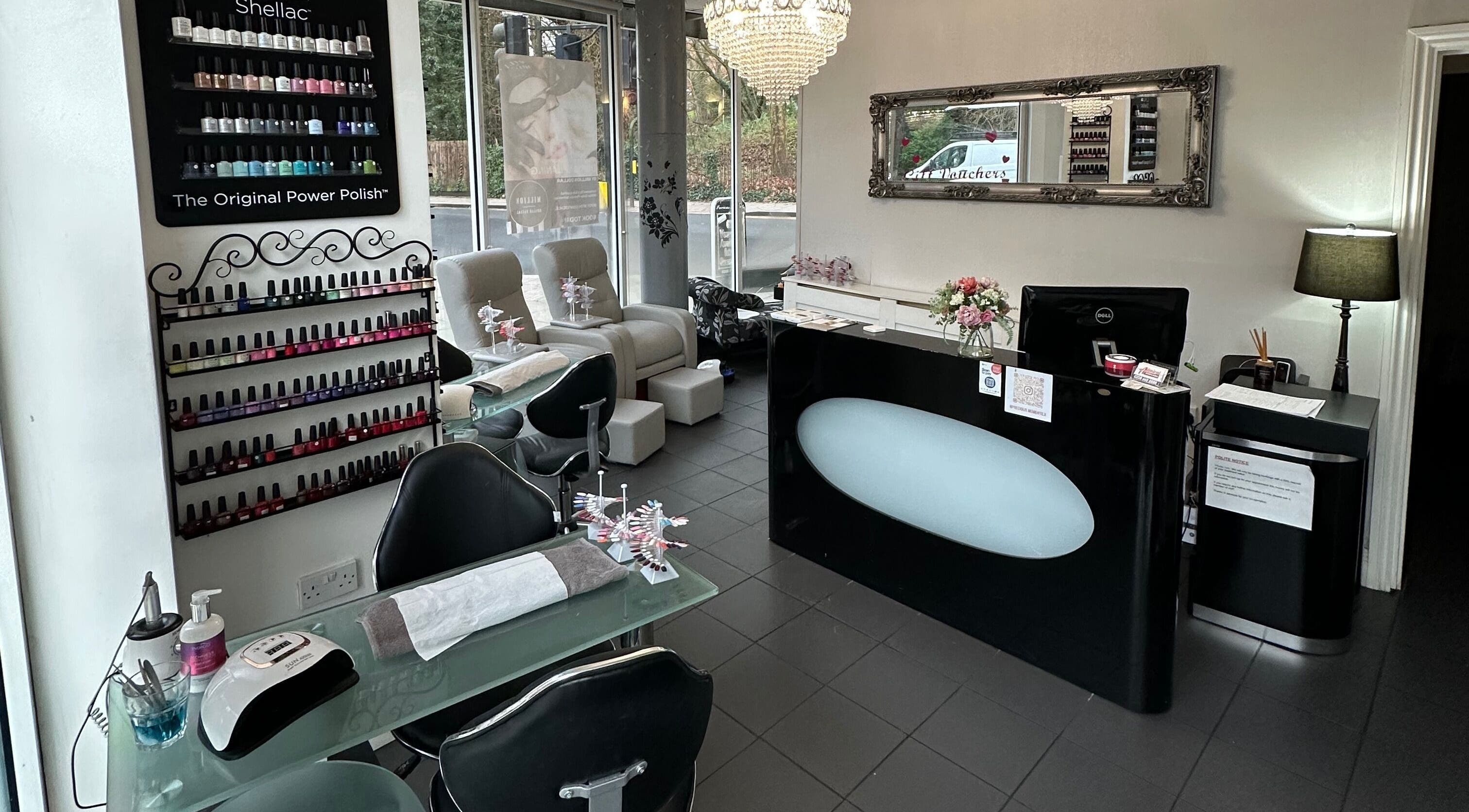 Interior of Precious Moments Beauty Salon, Coulsdon, England, GB showcasing elegant nail polish displays and seating.