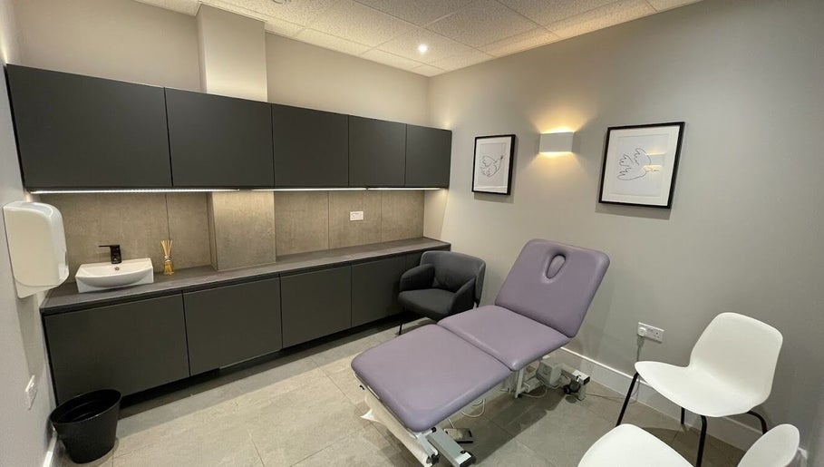 Elegant wellness room at By Serwah Wellness Wimbledon in London, England, GB featuring a plush treatment bed.