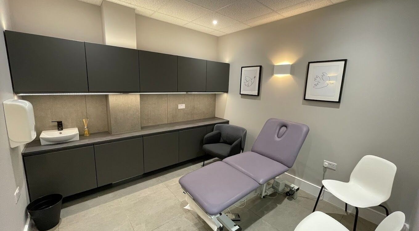 Elegant wellness room at By Serwah Wellness Wimbledon in London, England, GB featuring a plush treatment bed.