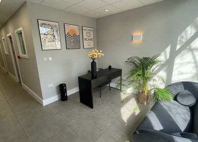 Modern waiting area at By Serwah Wellness wimbledon, London, England, GB, featuring elegant decor and natural light.